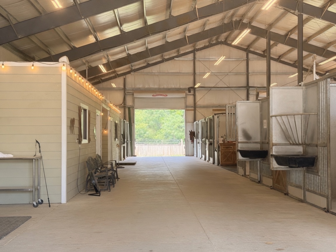 Barn aisle and stalls at Reagan Equine